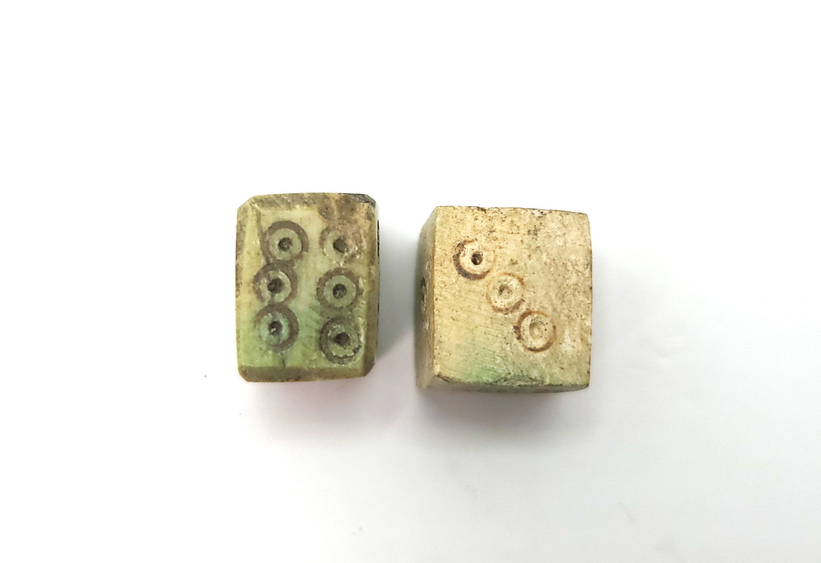 Roman Bone Dice 1st - 3rd Century AD: The cube with incised dotted rings on each facet numbering 1 to 6; 9 mm, 2 grams. Provenance information: Purchased by the current owner in London in 2022. From: Private collection D.G. collected sinc