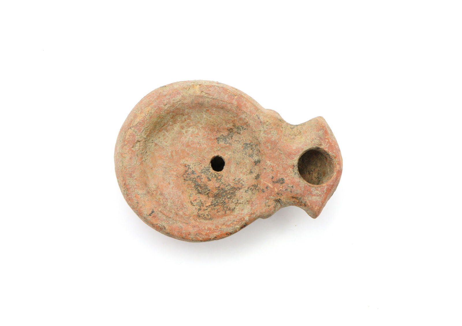 Ancient Roman Lamp, 1st-3rd Century AD: A ceramic oil lamp with thick nozzle and lower relief ; 45grams, 77mm in length. Fine condition. From the collection of a High Wycombe, Buckinghamshire, UK, gentleman, circa 2000.