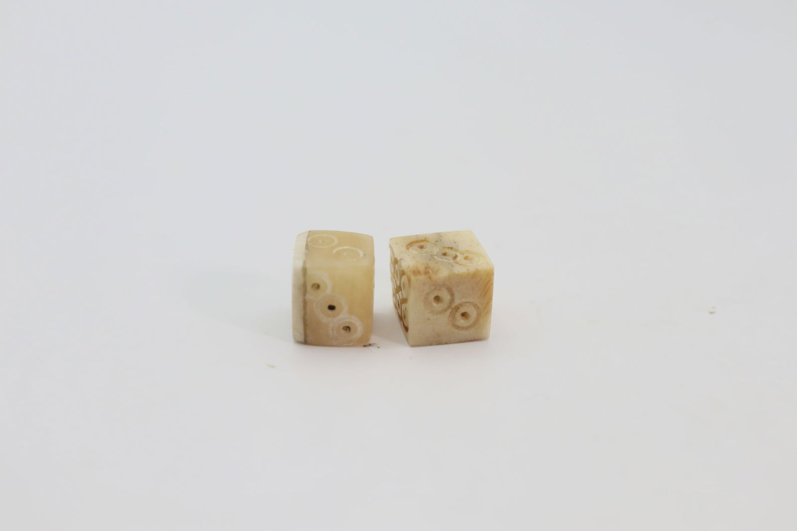 Roman Bone Dice, Circa 2nd, 3rd Century AD: Roman bone cube dice with incised dotted rings on each facet numbering 1 to 6; around 7.60 mm, 1.52 grams in total.Purchased by the current owner in London art market in 2022.