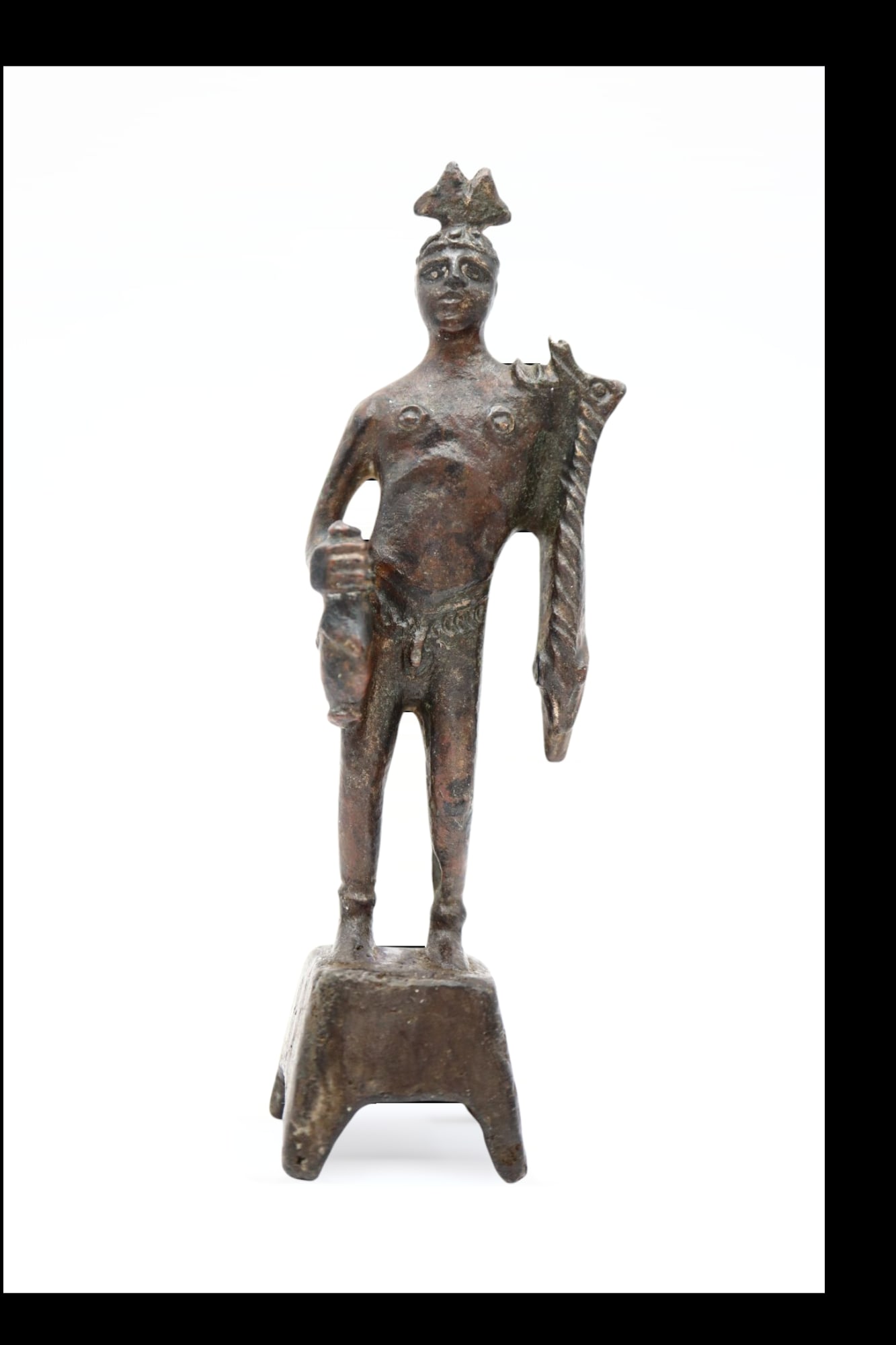 Roman Bronze Easter Provincial Figurine of Hermes, Circa End of 2nd, 3rd Century AD: Roman bronze figurine with probably Easter provinces origins, representing Hermes standing naked, stylized body standing on pedestal, wearing the winged hat and holding one of his attributes as the go