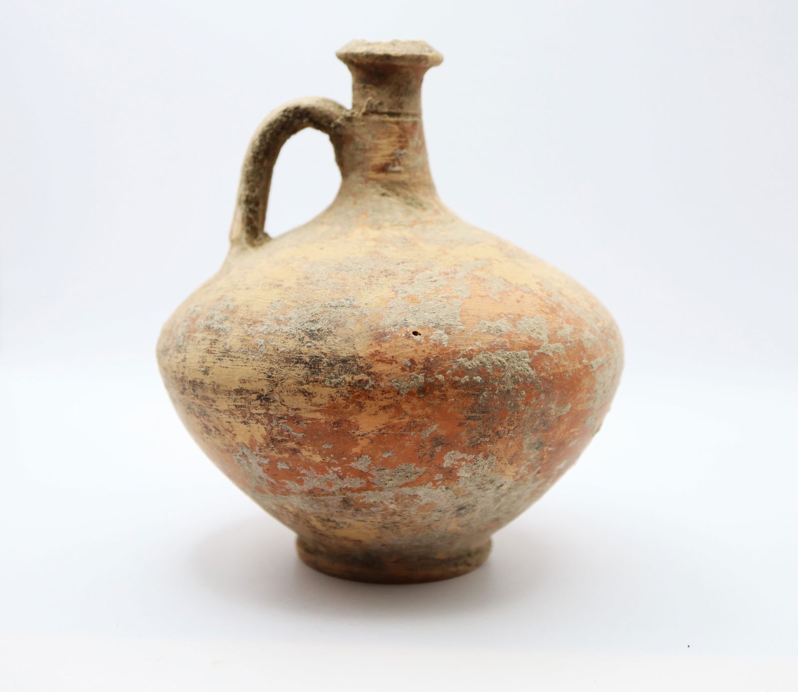 Roman Terracotta Wine Flagon, Circa 1st, 2nd Century AD: With globular body, thick basal ring, tall columnar neck with biconical collar, single strap handle to the rear; 6 in. around 360 grams, 15 cm .From the collection of a High Wycombe, Buckinghamshire,