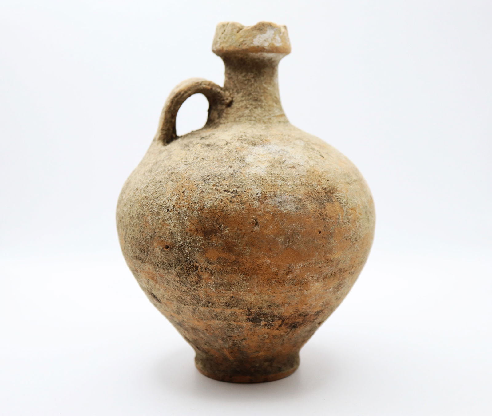 Roman Terracotta Wine Flagon, Circa 1st, 2nd Century AD: With globular body, thick basal ring, tall columnar neck with biconical collar, single strap handle to the rear; 440 grams, 17 cm .From the collection of UK gentleman.