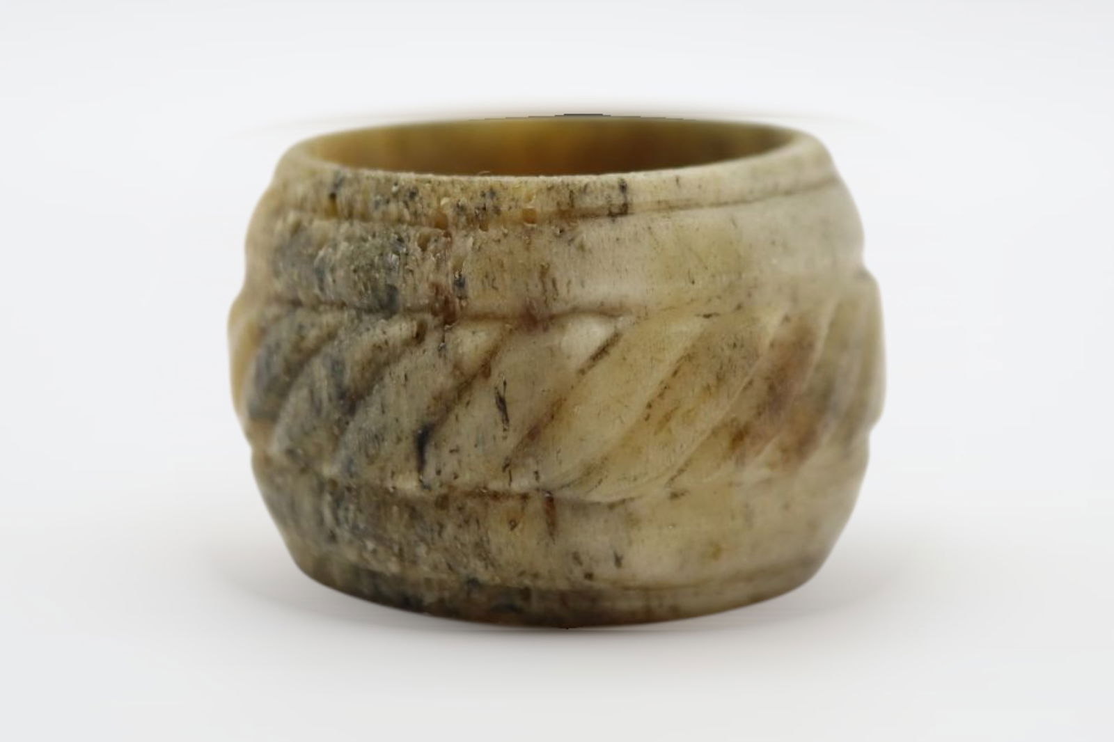 Roman Bone Ring , Circa 1st - 4th Century AD: A rare, bone made ring with overall decoration: 7.90 grams, 21.31mm internal diameter, 30.05 external diameter. Fine condition. From the private collection of a London gentleman, acquired on the UK ar
