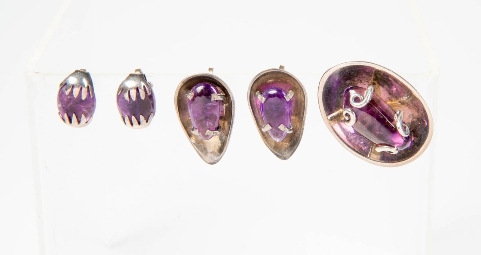 Two Pairs of Mexican Sterling and Amethyst Earrings.: Clip on, lengths 1 and .5 inches, together with a pin. Condition reports are not available for the items in this catalog. These are antique and vintage items, and will show signs of use and wear. We h