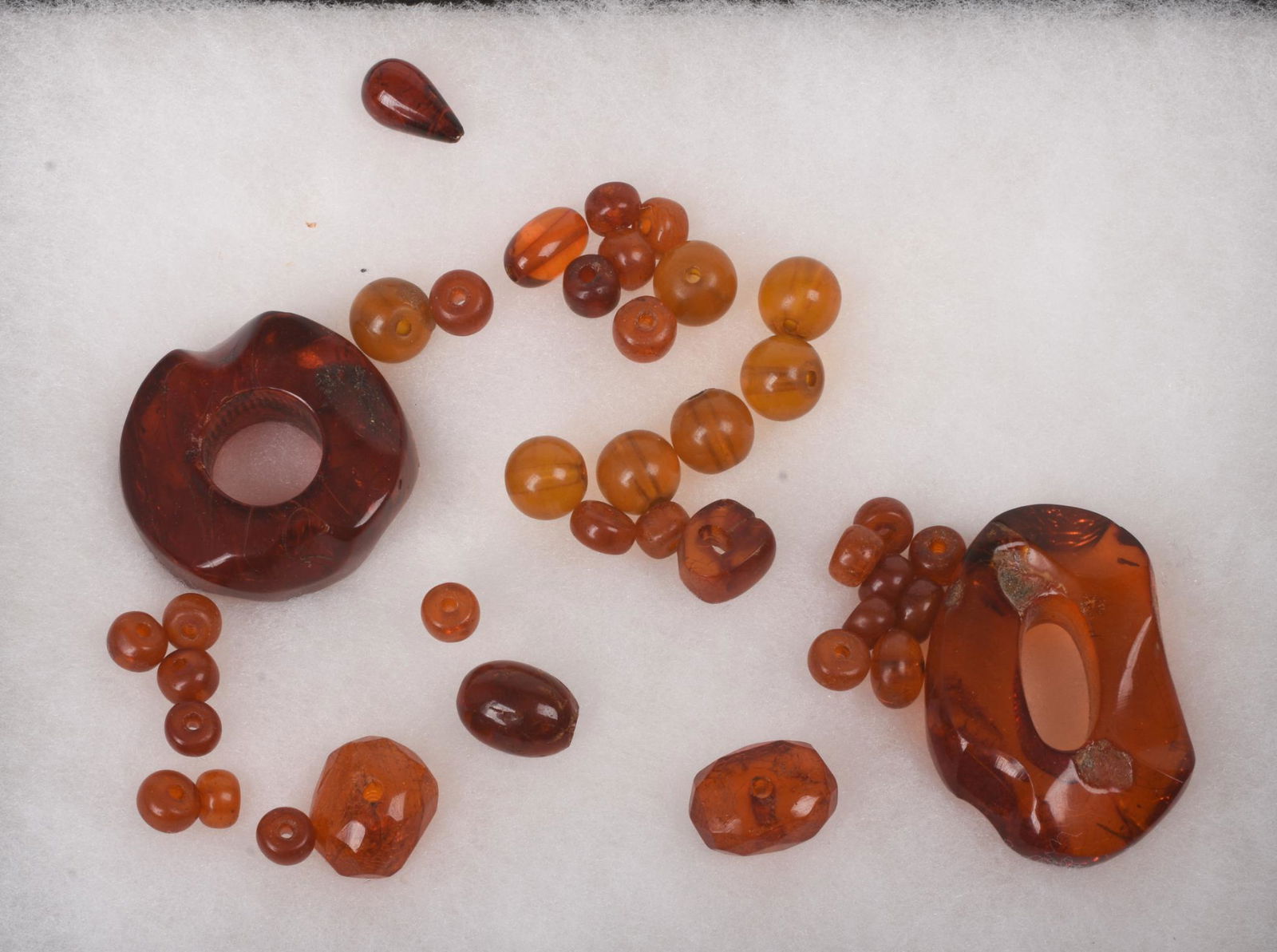Miscellaneous Amber Bead Lot.: Width of largest bead 2 inches. Condition reports are not available for the items in this catalog. These are antique and vintage items, and will show signs of use and wear. We have attempted to show a