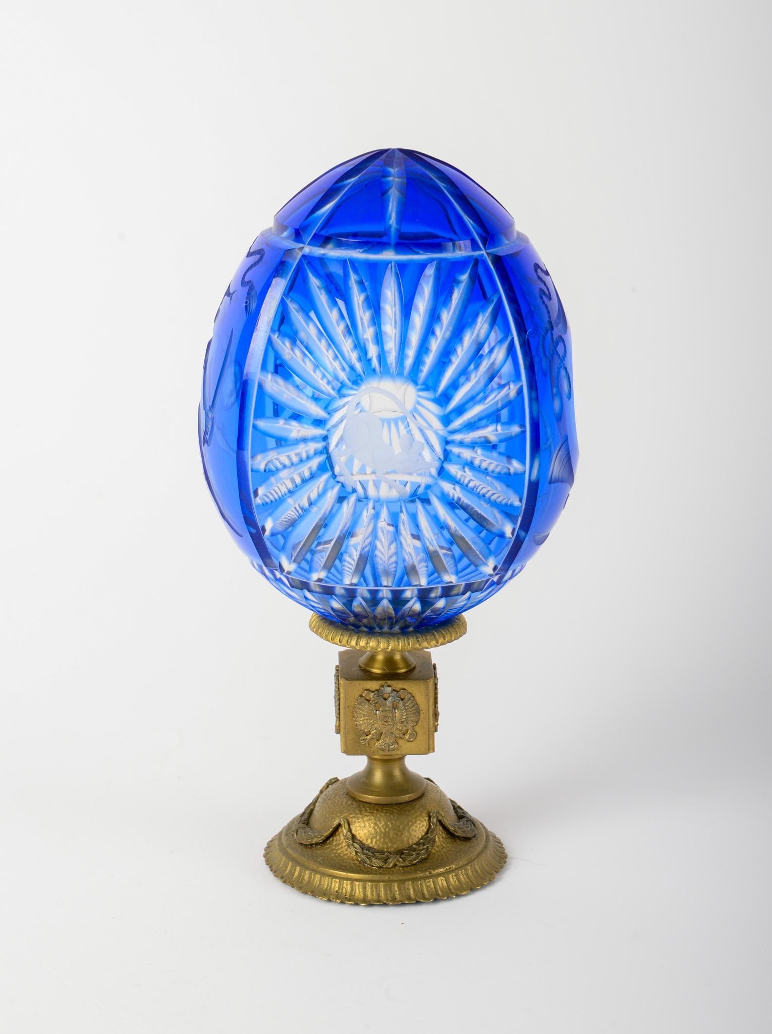 FABERGE BLUE GLASS EGG ON GILT STAND. (1 of 3)