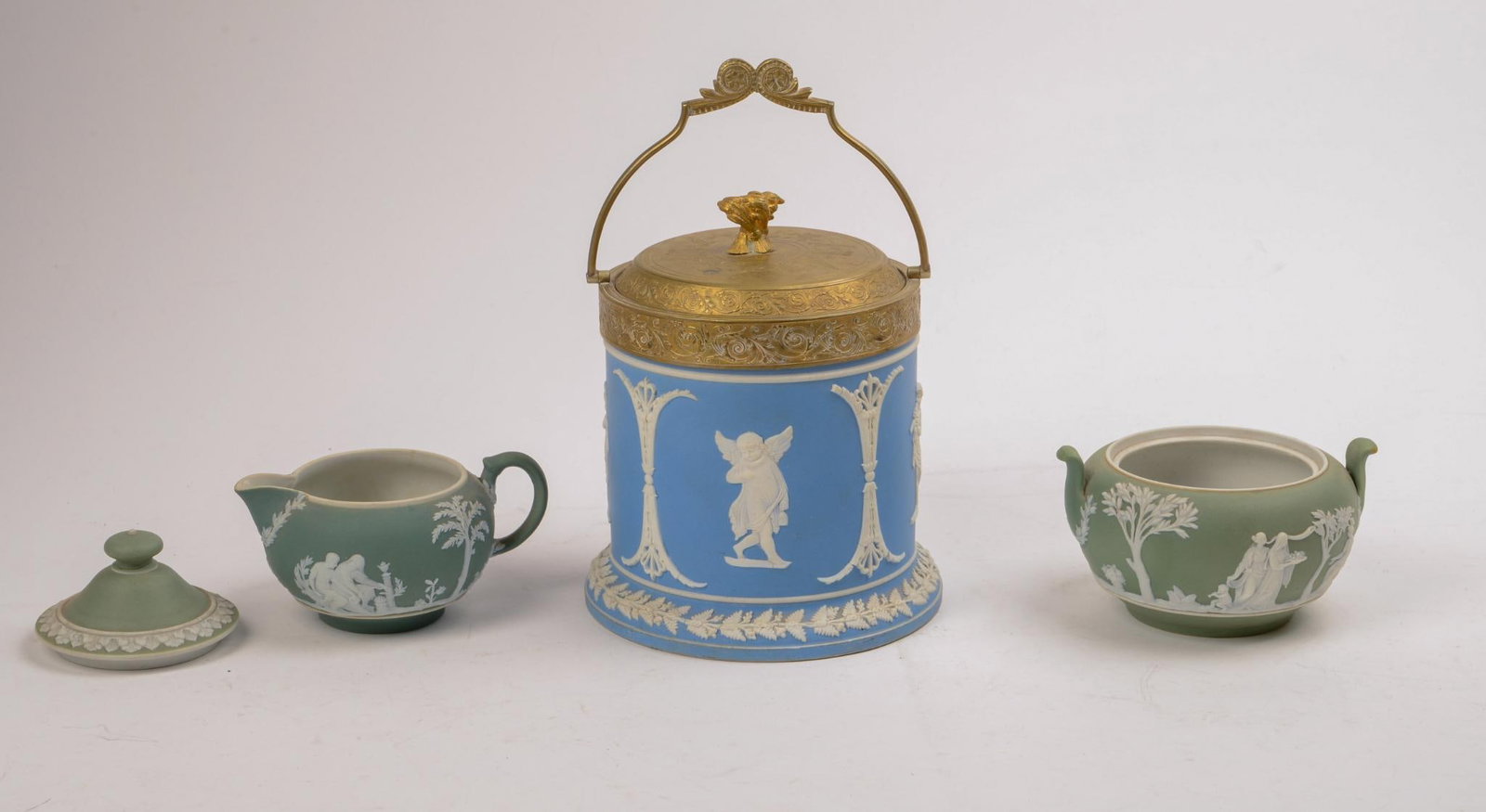 THREE WEDGWOOD JASPERWARE PIECES.: Covered jar, unmarked, height 6 inches, sugarbowl (lacking cover), and creamer. Good condition.