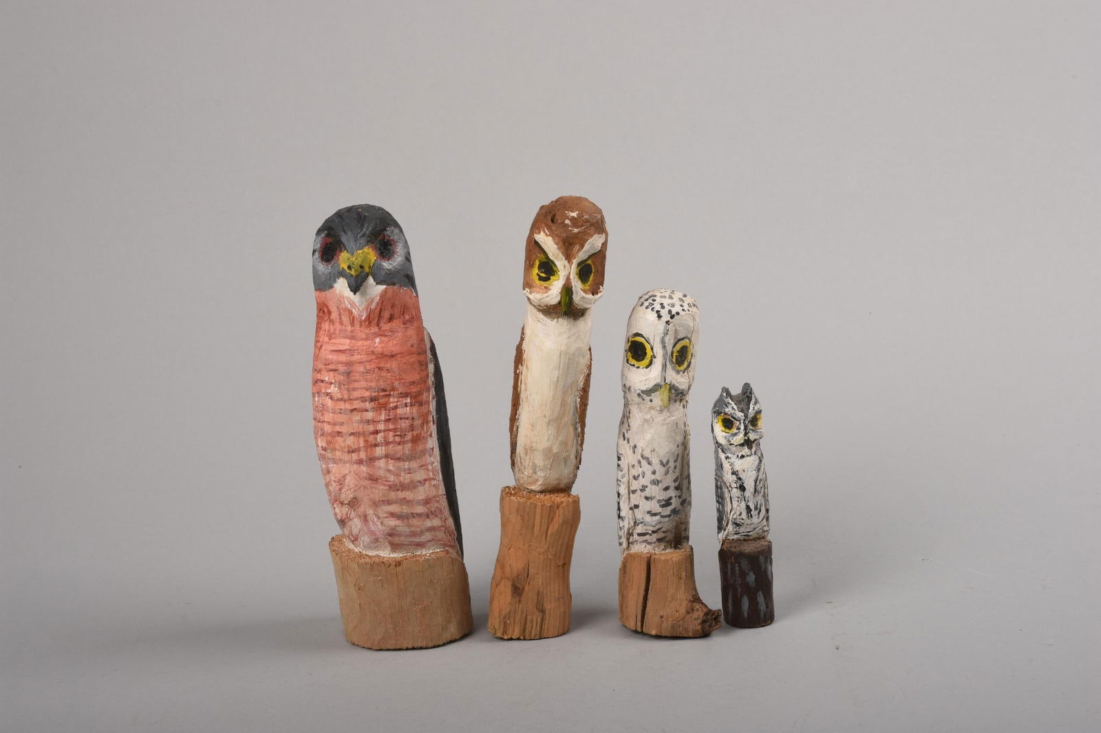 FOUR CARVED WOODEN OWLS.: Heights 3.5 to 6.5 inches.