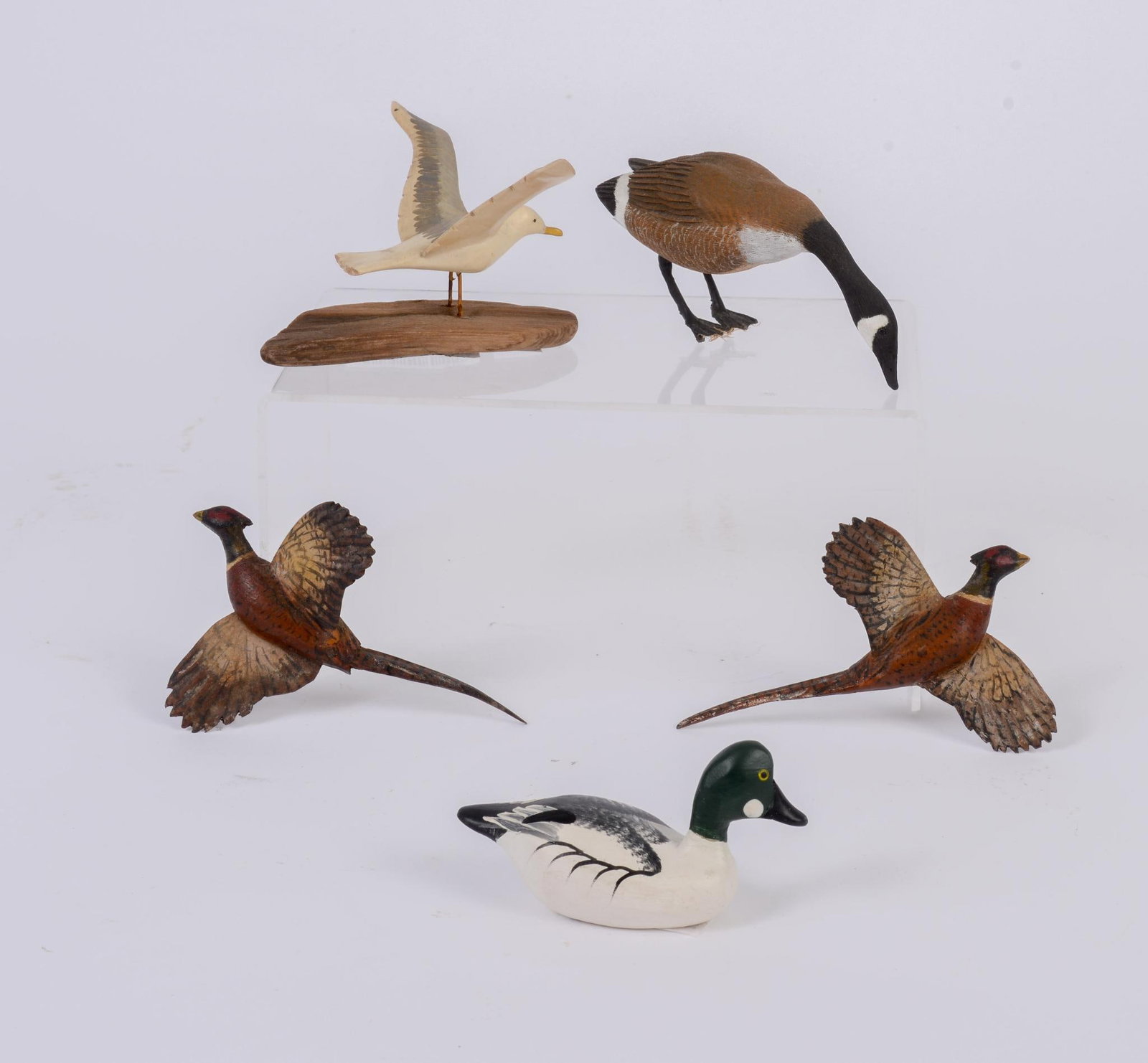 Group of Small Wood Carved Birds: Including two pheasants, goose, seagull and duck signed Clarence Bauer Havre De Grace MD, 1989, seagull height 2.75 inches