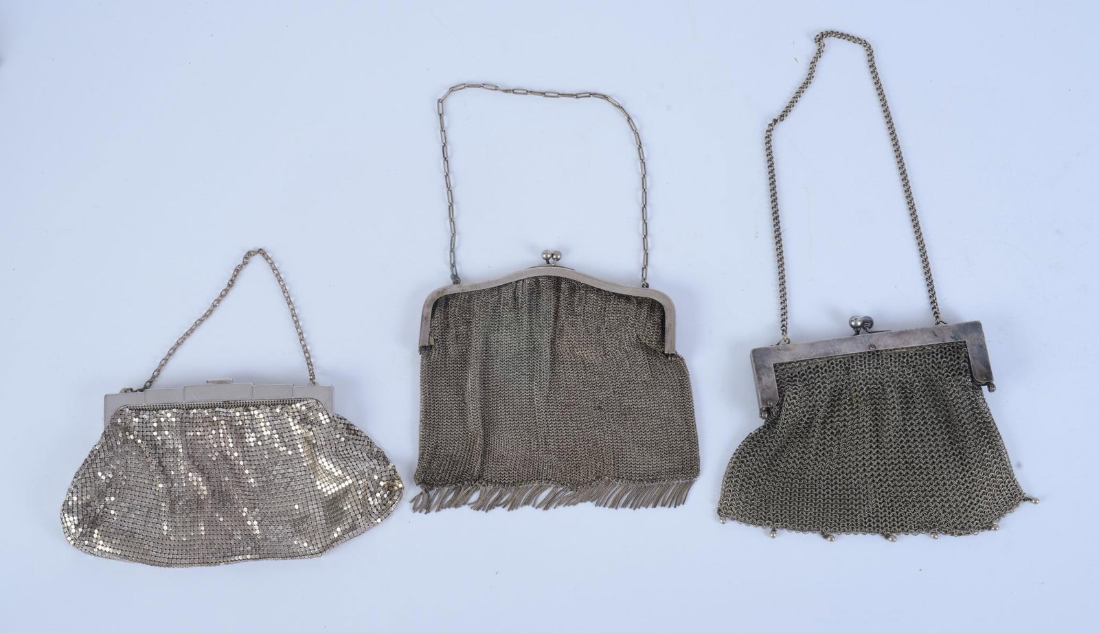 THREE SILVER MESH EVENING PURSES. (1 of 4)