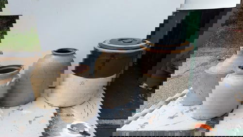 Six Stoneware Crocks.