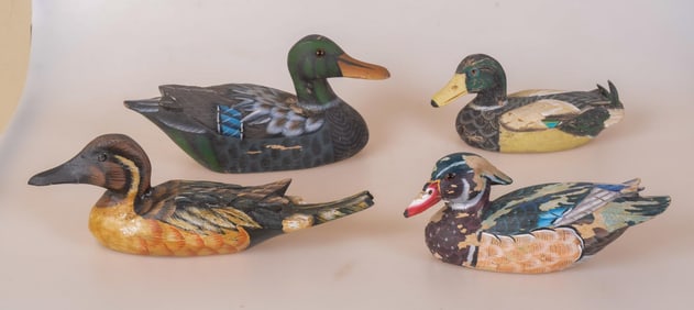 FOUR SMALL CARVED AND PAINTED WOODEN DECOYS