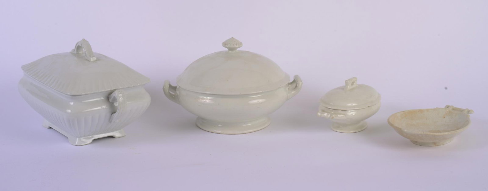 3 COVERED IRONSTONE AND PORCELAIN TUREENS WITH A SPOON REST: Largest tureen width 12 inches, good condition