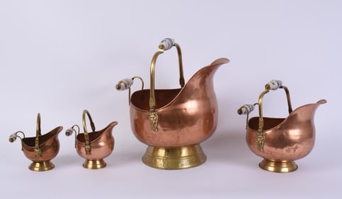 SET OF FOUR COPPER PITCHERS.