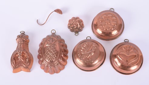 SIX COPPER MOULDS.