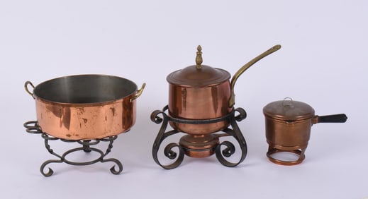 THREE COPPER POTS WITH STANDS.