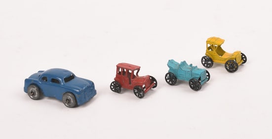 FOUR MINIATURE LEAD TOY CARS.