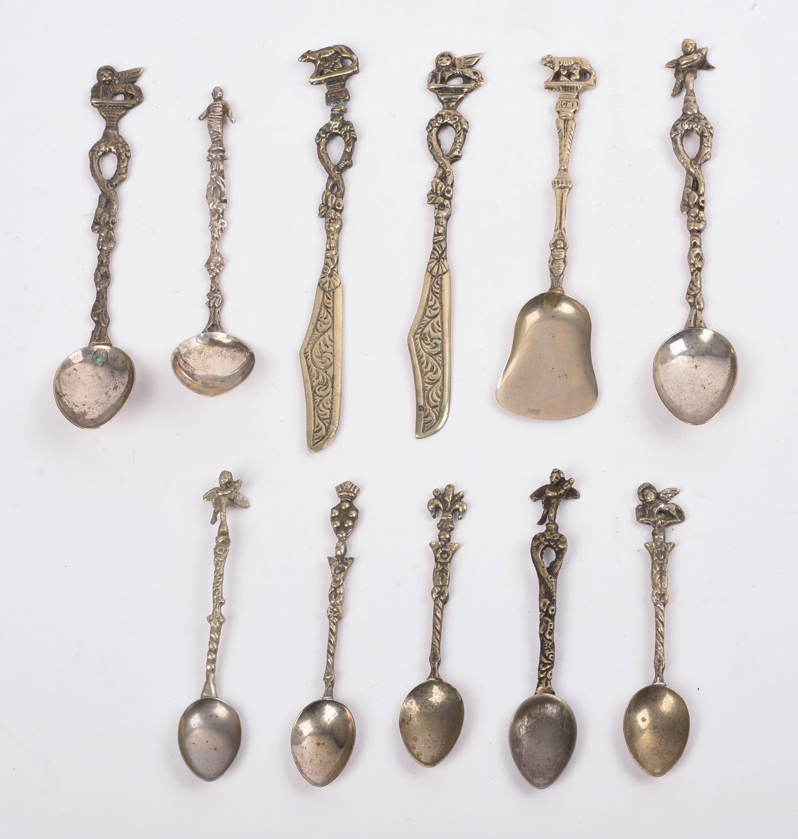 TWELVE ITALIAN DEMITASSE SPOONS AND KNIVES.: Lengths 3.5 to 5 inches.