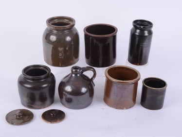 GROUP OF DARK GLAZED BROWN STONEWARE JUGS, JARS AND A VASE