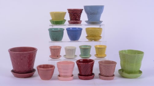 1 MCCOY PLANTER WITH GROUP OF OTHER COLORFUL CERAMIC PLANTERS