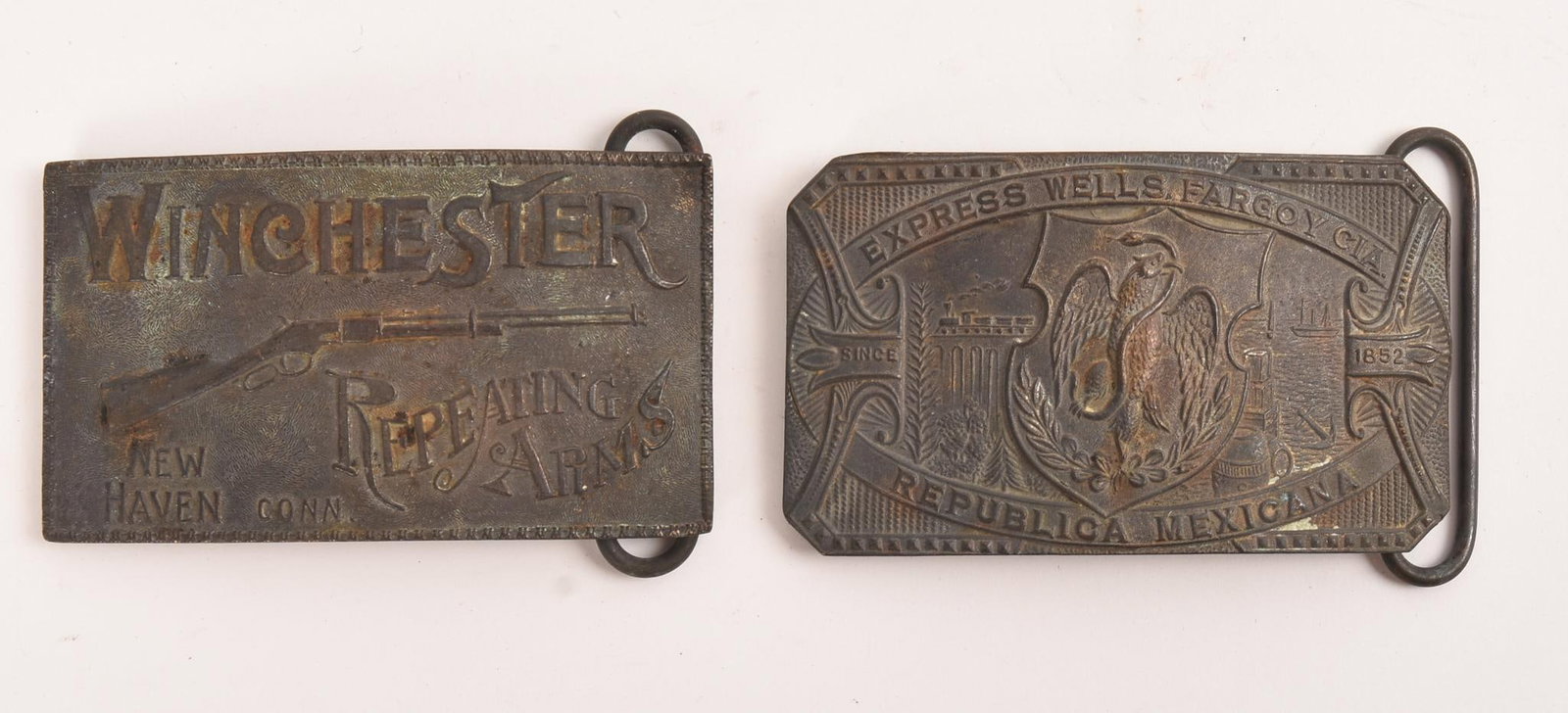 TWO TIFFANY BRONZE BELT BUCKLES: Wells Fargo and Winchester