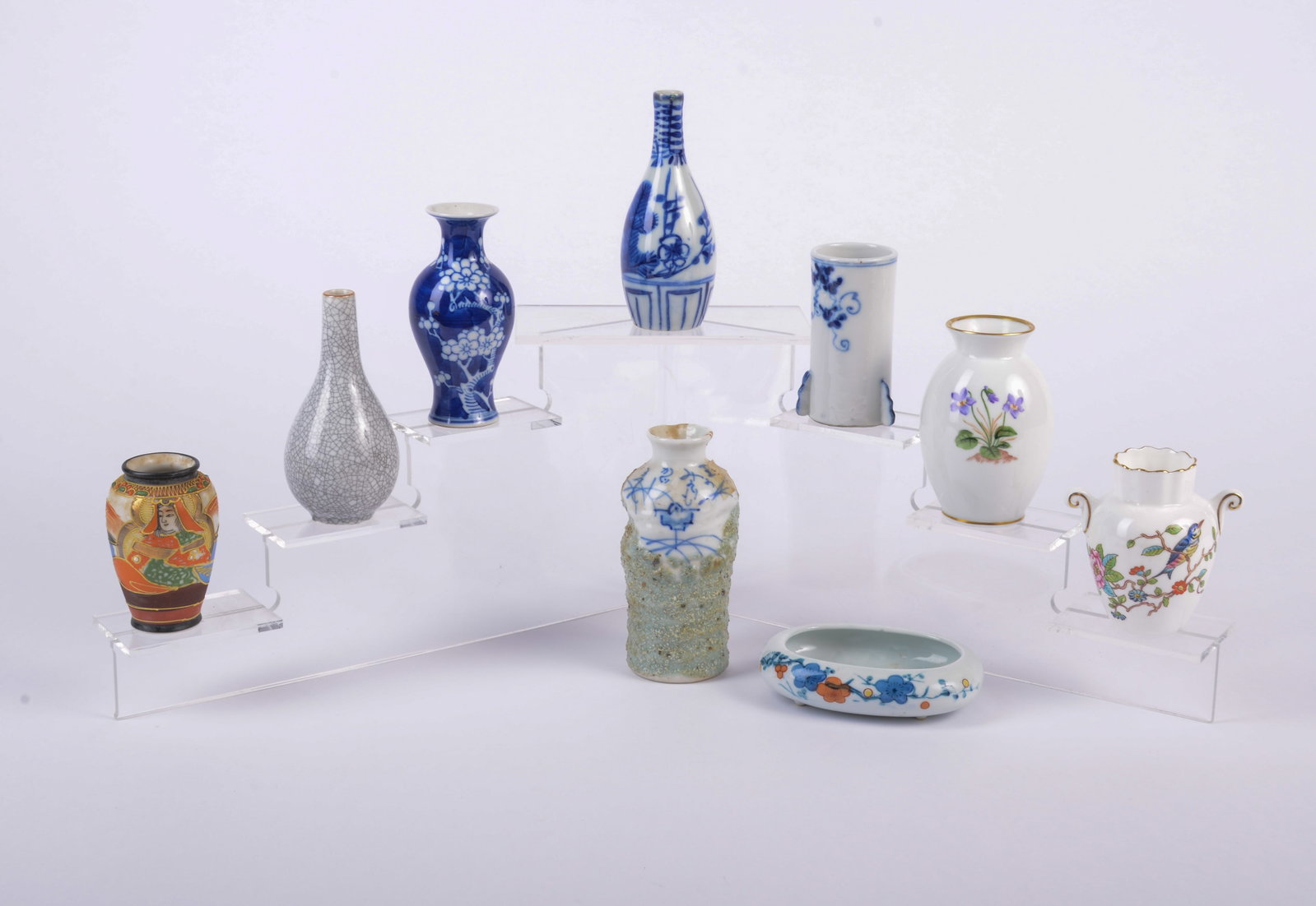 Group of Small Chinese and Japanese and European Vases: Including a small planter, 4 blue and white vases, a craquelure vase, inlaid Japanese vase and 2 floral, tallest vase 4.75 inches, good condition.