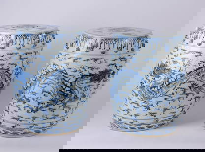 Pair of Chinese Ceramic Blue-and-White Garden Seats: Decorated with dragons and pierced tops. Height 17.5 inches. Good condition.