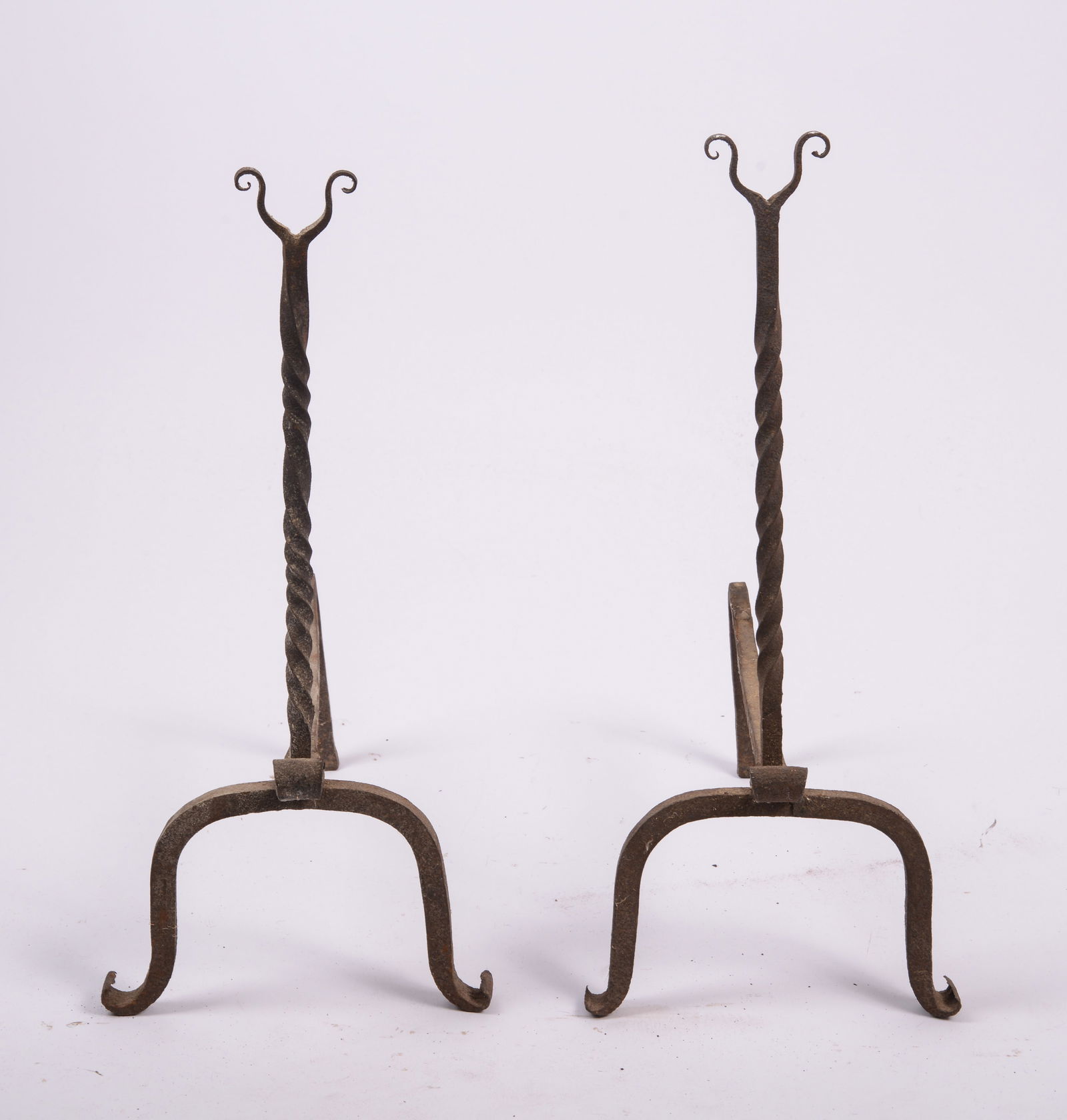 Pair of Wrought Iron Andirons.: Height 20 inches, depth 16 inches.