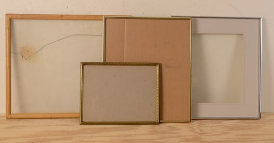 Three Metal Frames and One Wood Frame With Glass