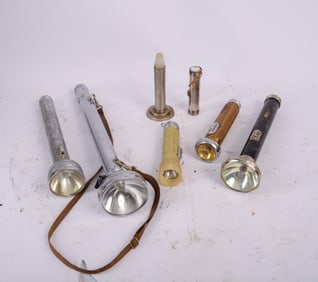 Seven Old Flashlights.