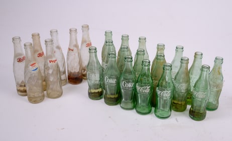 Crate of Pepsi and Coca-Cola Bottles.