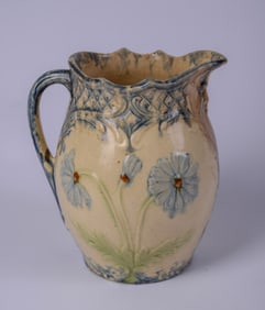 Pottery Pitcher With Flowers.