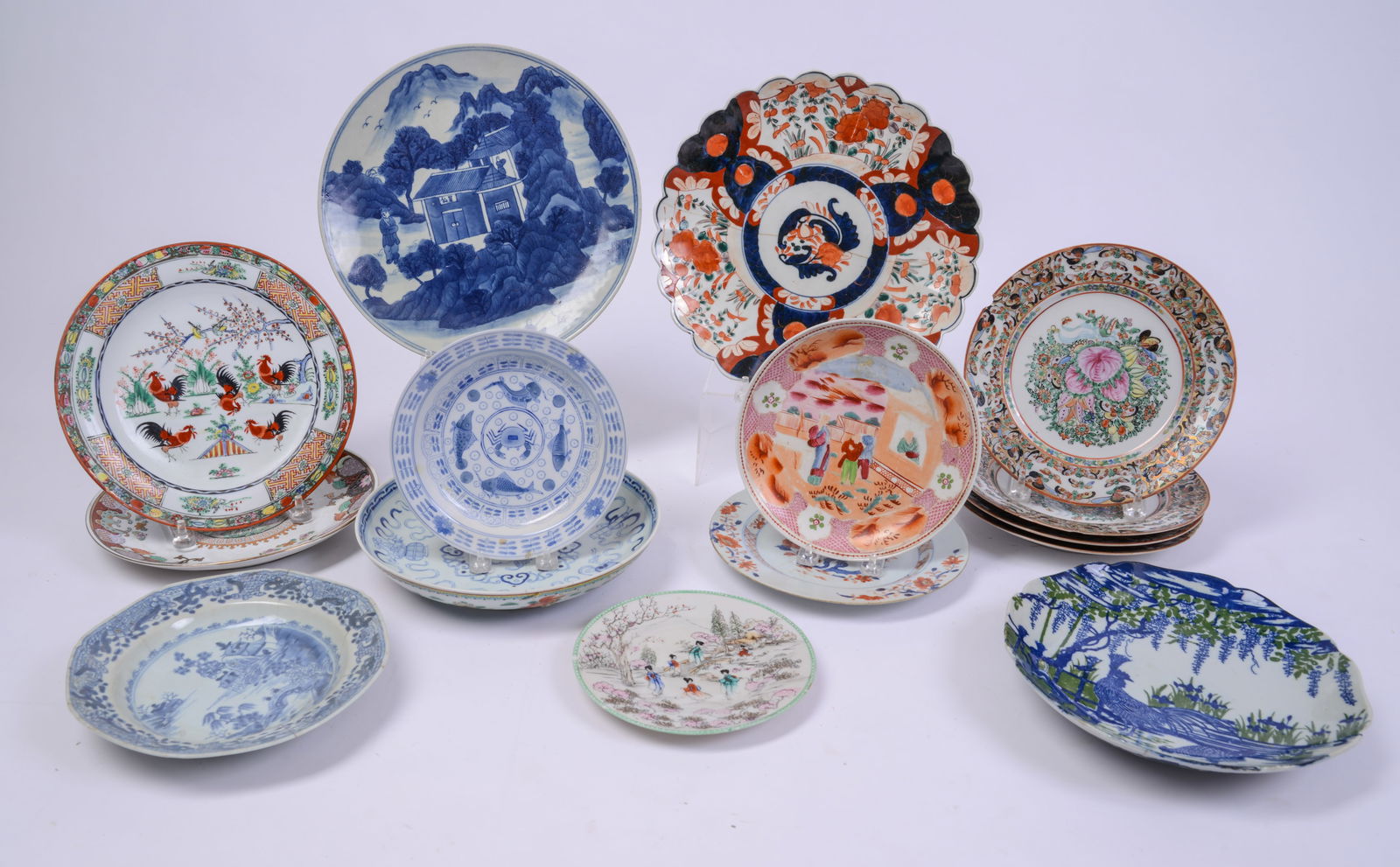 Fifteen Chinese Porcelain Plates.: Diameters 8 to 12 inches, 18th to 20th century. Some chips and cracks.