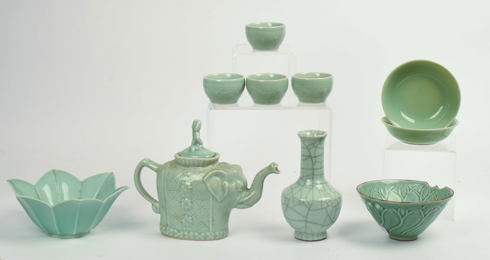 Group of Chinese Celadon Wares.: Elephant form teapot, height 8 inches, a vase, four teacups, two small bowls, two bowls.