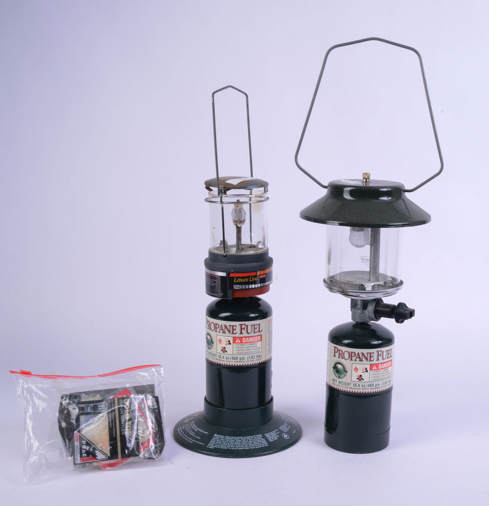 Two Coleman Propane Camping Lanterns.: Height 16 inches, not tested. WILL SHIP WITHOUT PROPANE CANISTERS.