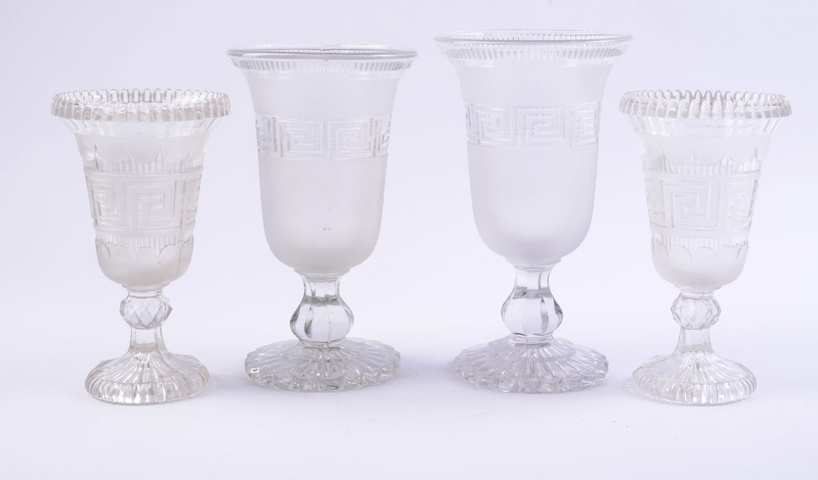 Four Roman Key Design Vases.: One pair Sandwich glass, height 8.25 inches. The others Molineux & Webb, 1865, height 10.25 inches. A few minor chips.