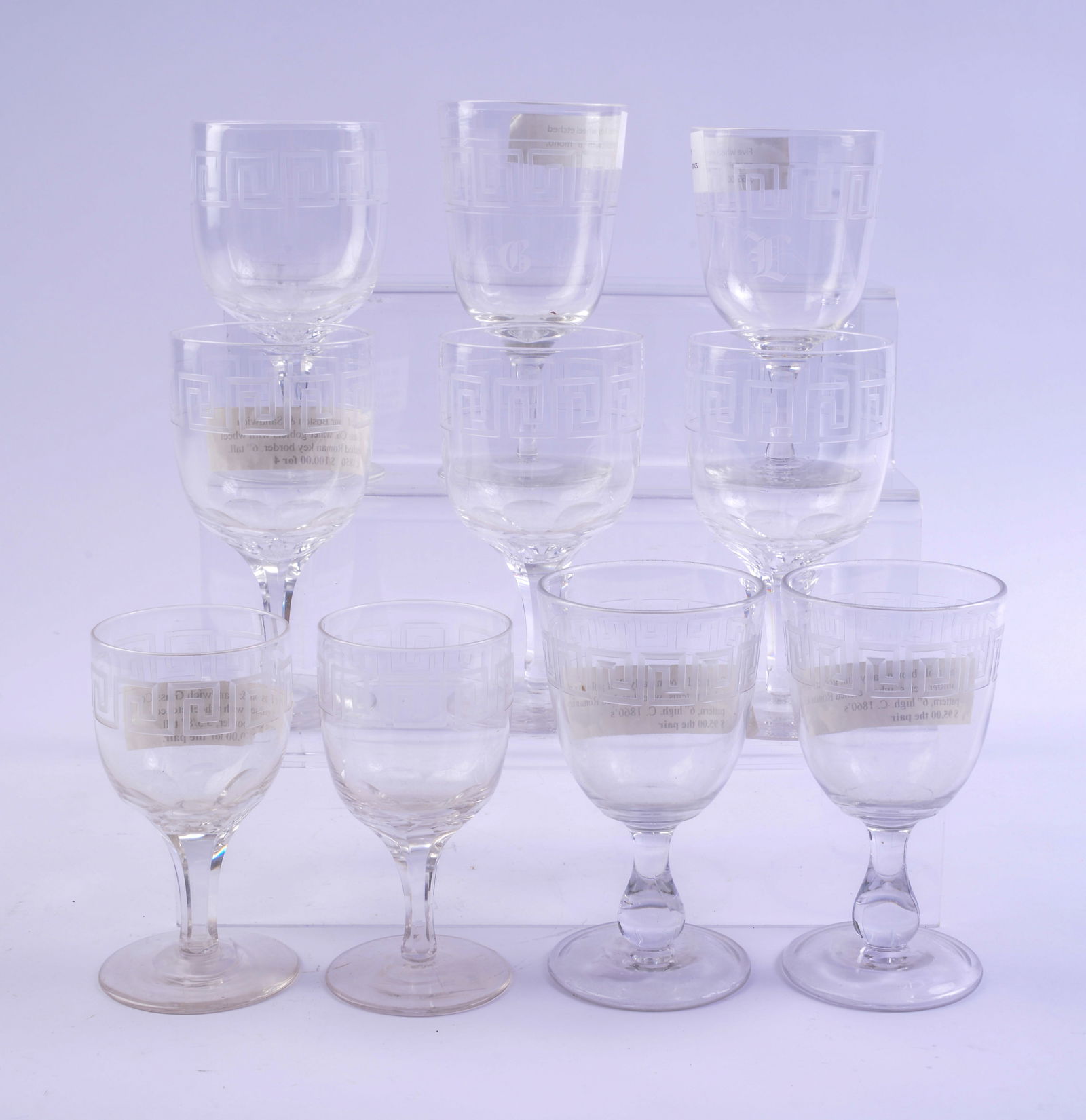 Ten Etched Glass Greek Key Design Goblets.: Heights 5.5 to 6.5 inches, Boston & Sandwich and others. Some small chips.