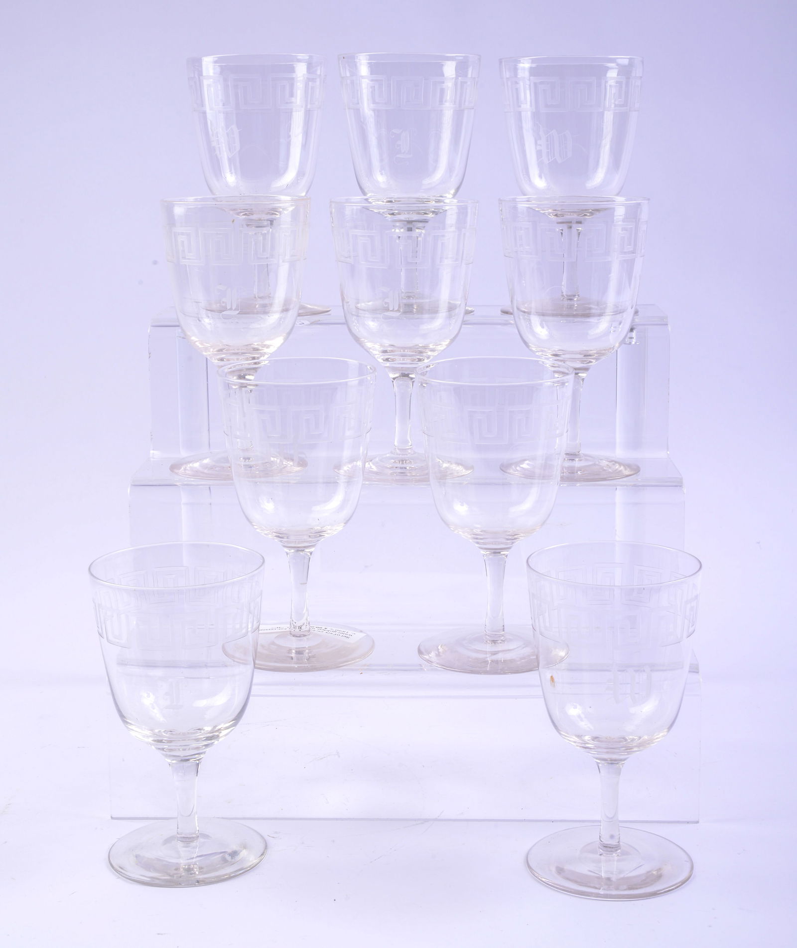 Ten Etched Glass Greek Key Design Goblets.: Height 6 inches. Some small chips.