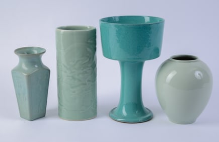 Four Porcelain Vases in Green Glaze.