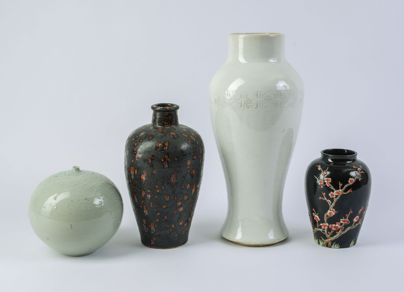 Four Chinese Porcelain Vases.: Heights 6.5 to 15 inches.