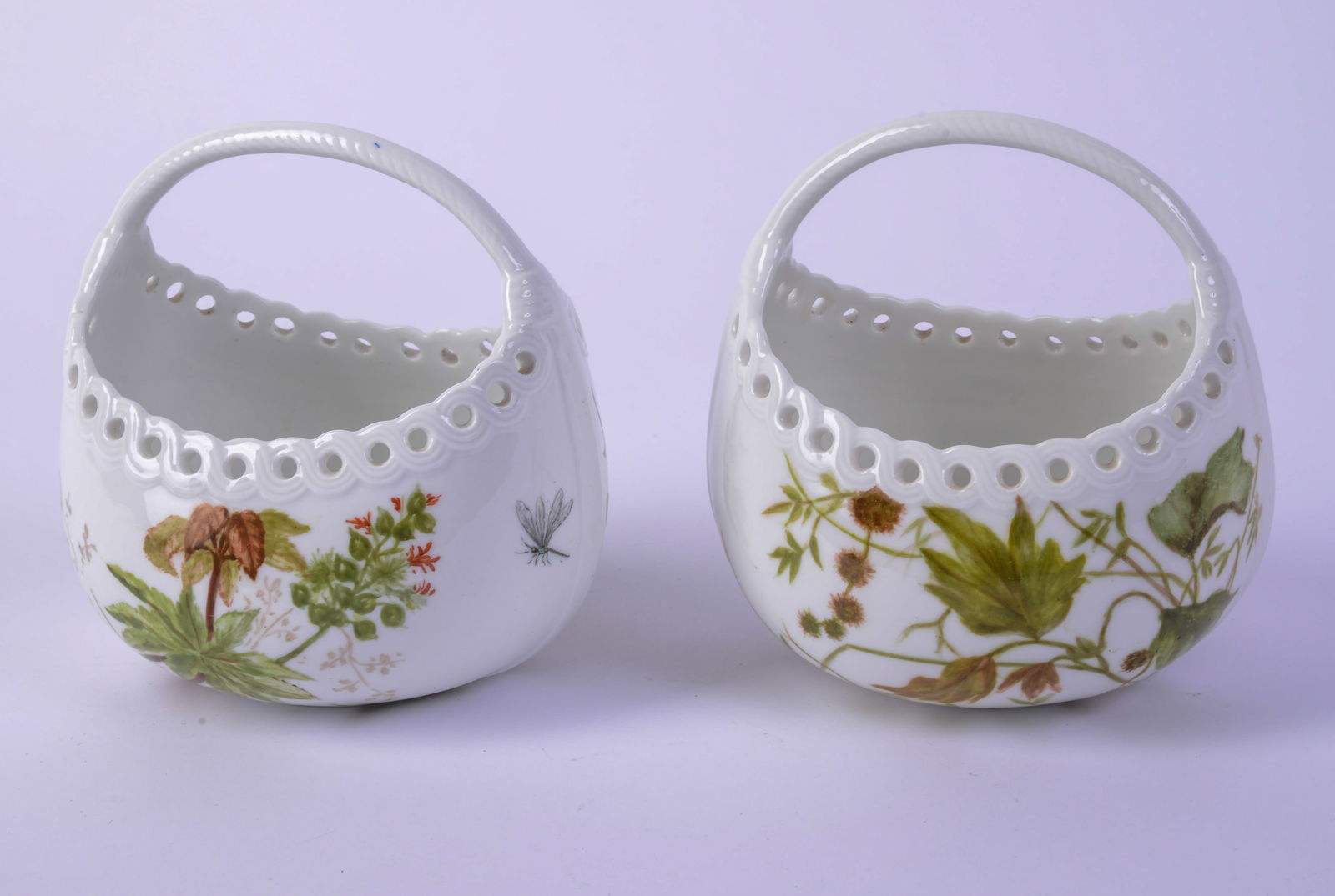 Pair of Floral Decorated Porcelain Baskets.: Length 5 inches. Good condition.