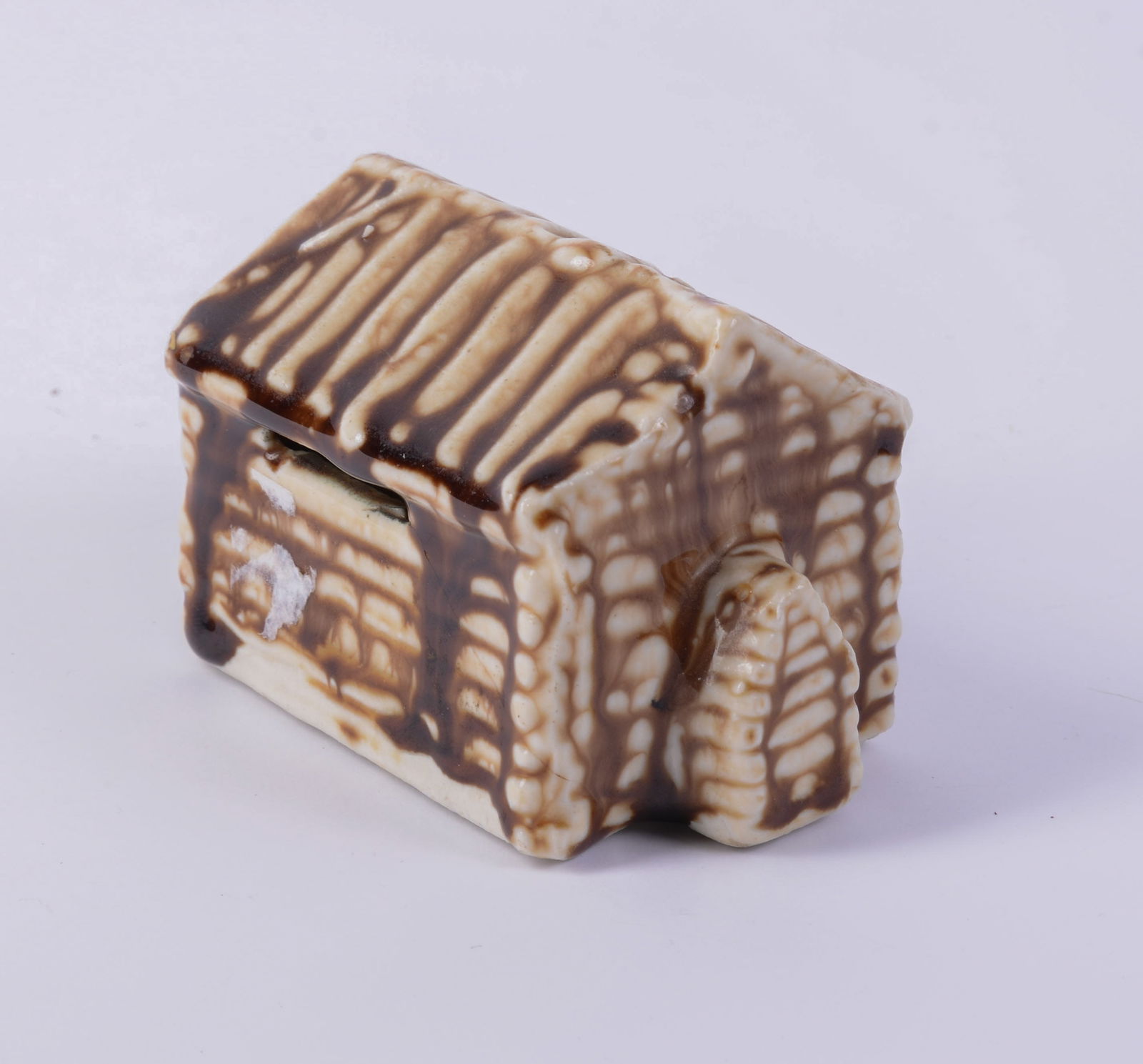 Van Dyk Porcelain Log Cabin Bank.: Where Abraham Lincoln was born, length 4 inches, good condition.
