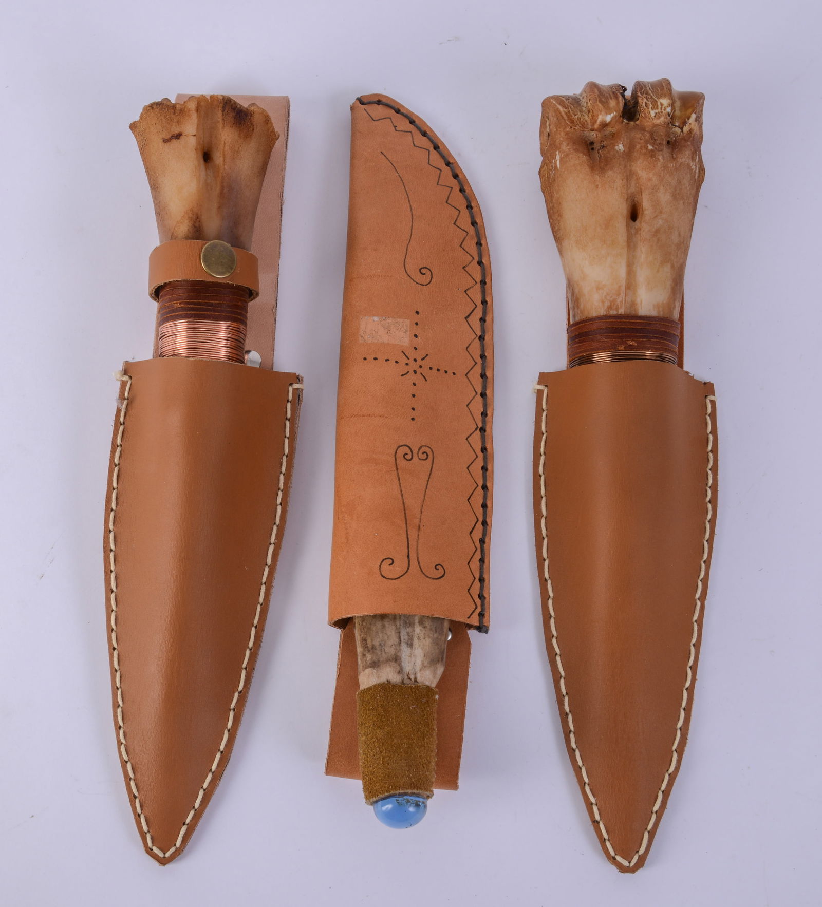 Three Bone Handled Knives.: With leather sheaths, lengths 11.5, 12 and 13 inches.