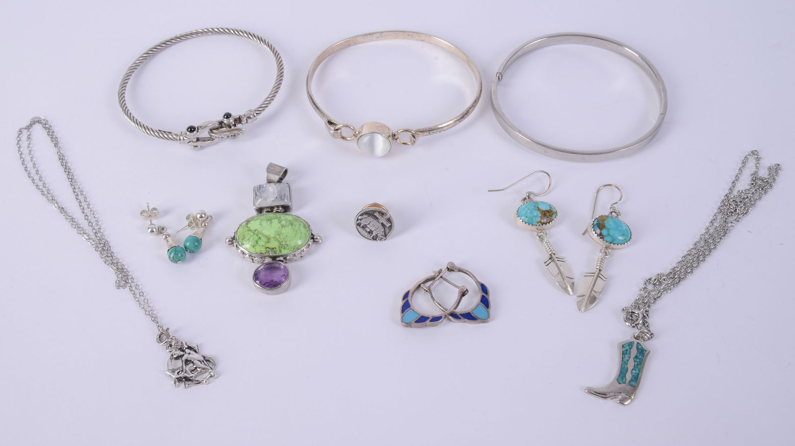 Group of Sterling and Costume Jewelry.: Two sterling bracelets, two pairs of sterling earrings, Lutheran lamb pin, two necklaces and a pendant.