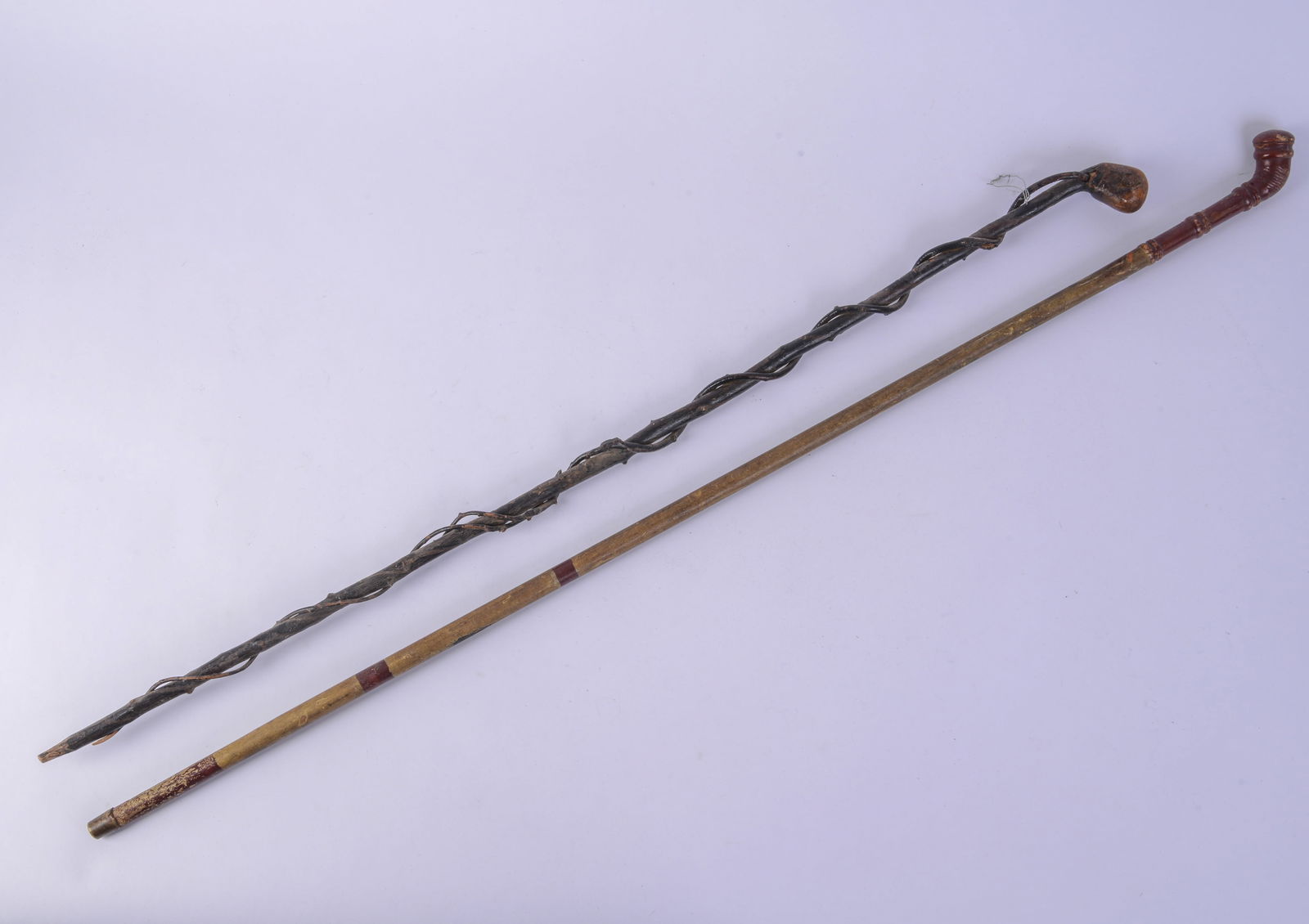 Two Canes.: Lengths 40 and 36 inches.