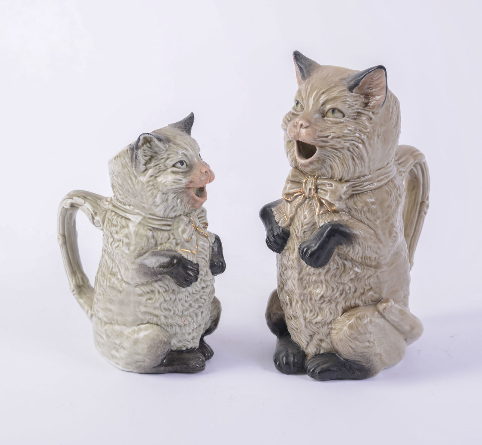 Two Seated Cat Pitchers. - 2