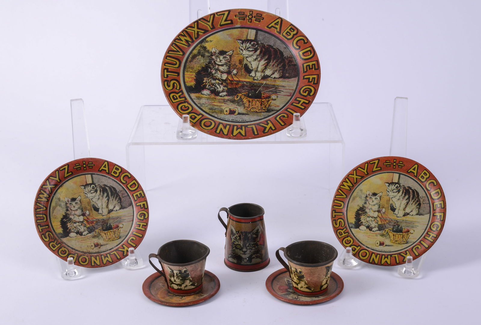 Eight Children's Tin Wares With Cats.: Five plates, diameters 2.75 to 6.5 inches, and three others. Some scratches.