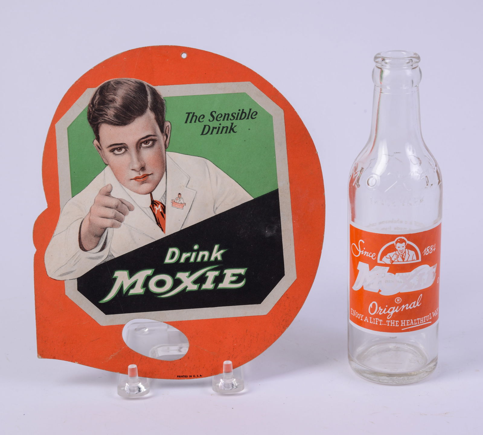 Moxie Advertising Hand Fan.: 8 x 7 inches, good condition. Together with a Moxie bottle.