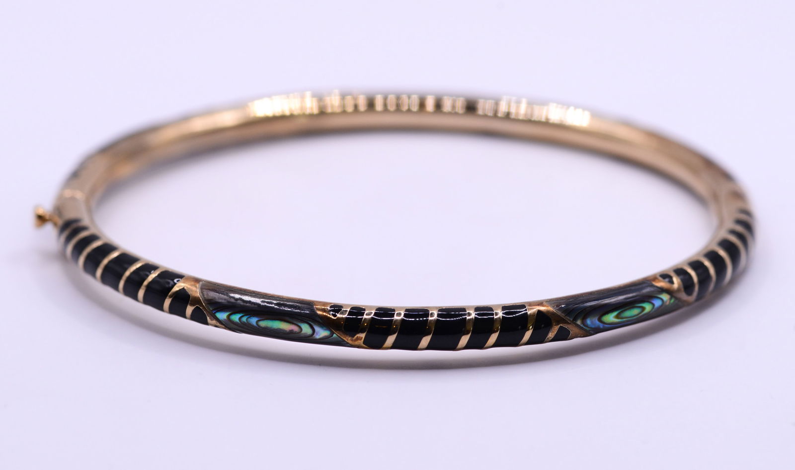 Jan Leslie Gold Toned Sterling, Onyx and Abalone Bracelet.: Diameter 2.25 inches, 17.82 grams