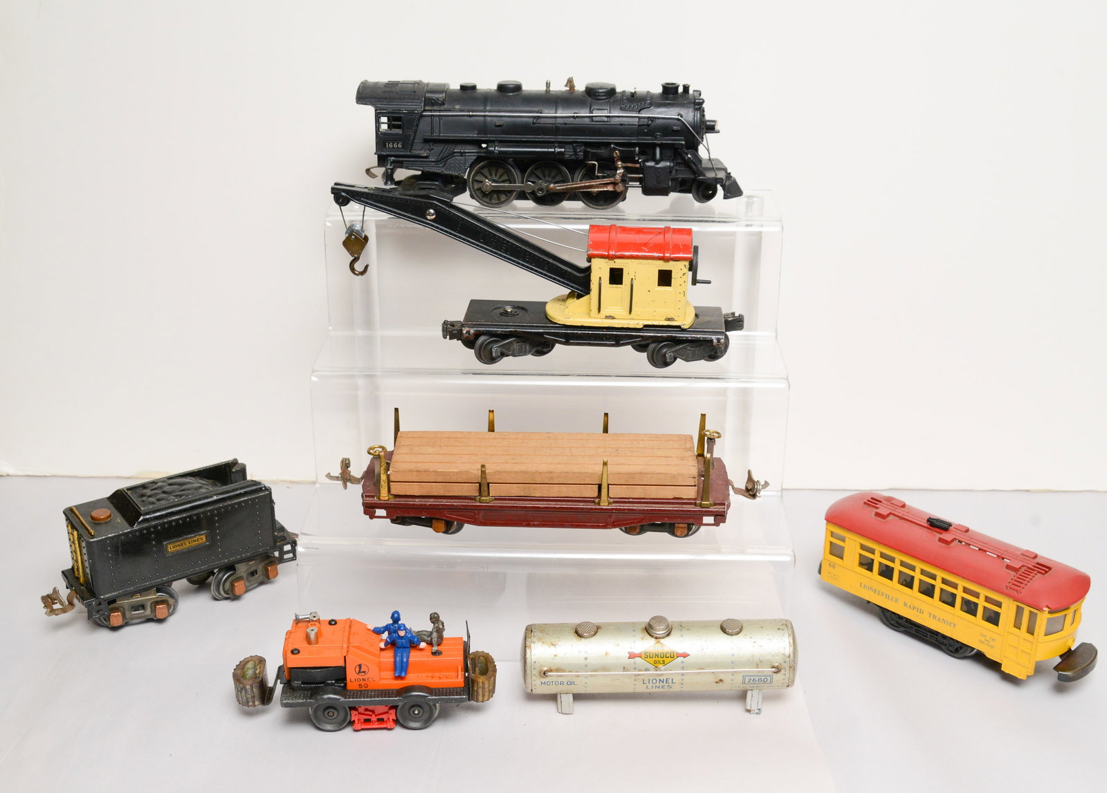 Lionel 1666 Locomotive, Tender, and Two Cars.: 2560 crane, stake car. Also includes Lincolnville Rapid Transit car.